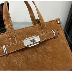 Brown PU leather fashion women's shoulder bag with metallic lock detail for daily commute.
