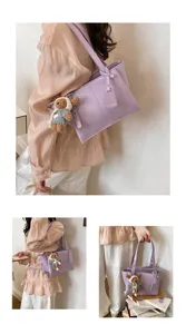 Elegant purple tote bag with cute bear pendant, large capacity shoulder bag for women daily commute.