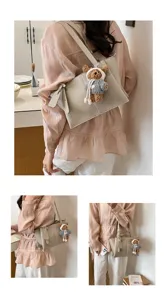 High-end casual tote bag for women, large capacity leather shoulder bag with cute bear pendant.