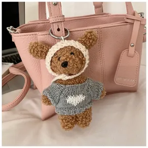 Cute plush bear keychain with knitted hat and sweater, adorable bag charm accessory.