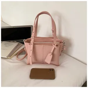 Pink PU leather tote handbag, stylish underarm shoulder bag with top handles and charm.