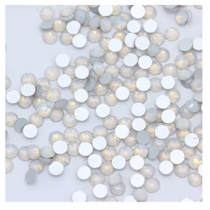 Flatback nail art rhinestones, snow opal crystal glass gems for DIY manicure decor.