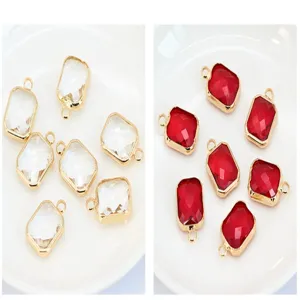 Close-up detail of rectangular crystal pendants with gold metal edges for DIY handmade jewelry.