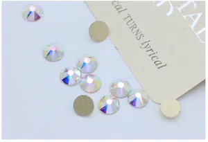 Flat-back AB crystal rhinestones detail shot, sparkling multi-cut glass gems for nail art.