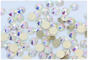 Detail view of AB flatback glass rhinestones, sparkling crystal gems for nail art and phone cases.