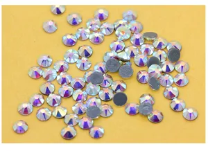 Close-up detail of AB crystal flatback rhinestones, brilliant multi-facet shine for DIY nail art.