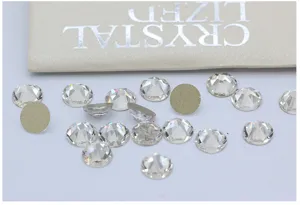 Close-up detail shot of iridescent flatback glass rhinestones for nail art and phone cases.