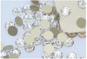 Clear flatback glass rhinestones for nail art and phone case DIY crafts, sparkling multi-cut crystals.