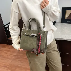 Olive green retro shoulder crossbody tote bag with chic top handles and cute dog charm.