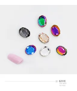 Close-up of colorful oval mirror nail rhinestones, sparkling glass crystal decor for DIY nail art.