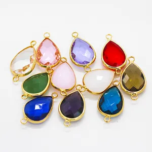Colorful teardrop glass charms with gold bezels and double loops for DIY jewelry making.