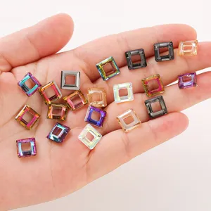 Close-up detail of colorful square hollow crystal rhinestone charms for DIY jewelry making.