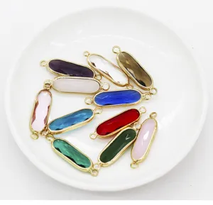 Detailed view of colorful long oval double loop bezel charms, ideal for DIY jewelry making.