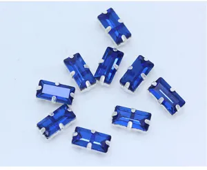 Detailed view of rectangular blue sew-on rhinestones with silver claw settings for DIY crafts.