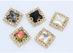 Detailed close-up of square sew-on claw rhinestones with sparkling crystal borders for DIY crafts.