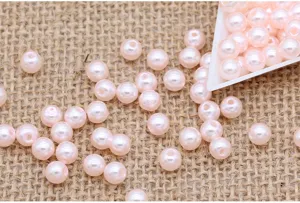 ABS plastic imitation pearl loose beads for clothing accessories and jewelry crafting.