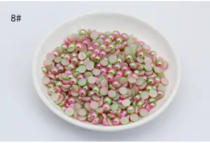 Detail shot of gradient mermaid flatback half pearls in dish for DIY phone case and nail art.