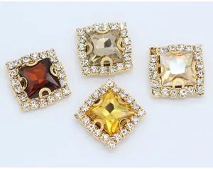 Close-up of 12mm square claw rhinestone buttons with crystal trim for DIY sewing crafts.