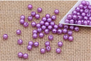 Purple ABS plastic imitation pearl beads detail, double hole round craft beads close up