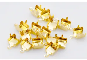 Gold plated claw chain connectors detail view, essential DIY jewelry making findings for crafts.