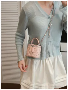 Pink quilted chain crossbody bag for women, cute mini vanity box purse with rhinestones and pearls.