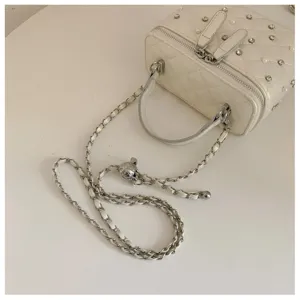 White quilted vanity bag with pearls and rhinestones, stylish chain strap and chic box design for women.