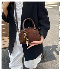 Retro brown suede bowling bag, vintage small handbag, chic women's shoulder crossbody bag.