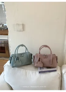 Women's stylish pebbled leather Boston pillow handbag, casual crossbody shoulder bag with top handles.