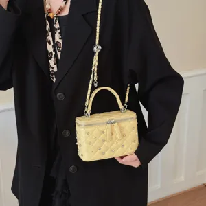 Yellow quilted chain vanity crossbody bag for women, stylish small box shoulder bag.
