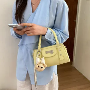 Trendy yellow rivet bowling bag pillow handbag with cute bear charm for daily women commute