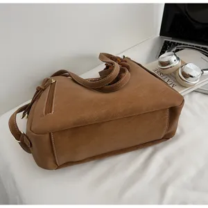 Chic large capacity brown shoulder tote bag for women, stylish textured casual daily handbag.