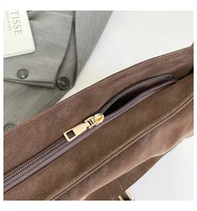 Brown vintage shoulder bag detail view, chic underarm bag for women, daily commute handbag.