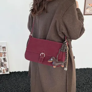 Retro crossbody shoulder bag for women, winter fashion underarm bag with cute dachshund charm.