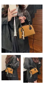 Vintage suede bowling bag for women, chic patchwork shoulder crossbody handbag with charm.