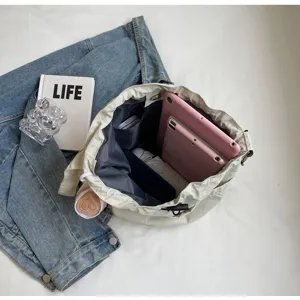 Large capacity casual canvas bucket bag for women, stylish daily commute shoulder bag.