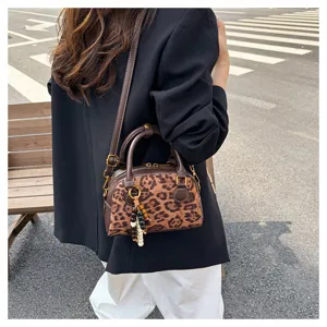 Chic leopard print bowling shoulder bag, stylish retro top handle crossbody bag for women.