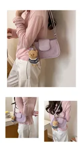 Trendy purple star shoulder bag with cute bear charm, elegant leather design for daily commute.