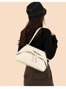 Chic retro underarm shoulder bag for women, premium solid cream leather crossbody purse.