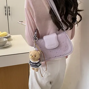 Stylish purple star shoulder bag for women, trendy leather crossbody bag with cute teddy bear.