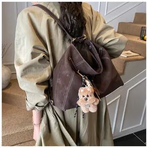 Vintage multi-functional women shoulder bag retro brown slouchy tote backpack with plush bear.