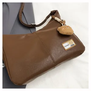 Retro brown soft leather hobo shoulder bag for women, casual versatile commuter dumpling handbag.