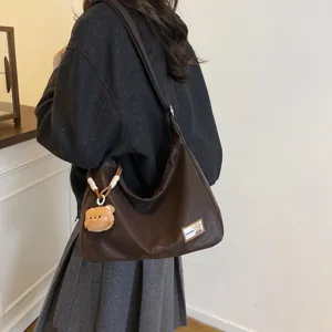 Retro soft leather dumpling shoulder bag casual commuter crossbody bag with cute bear charm