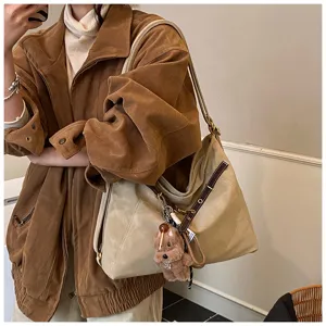 Korean vintage suede shoulder tote bag detail, large capacity design with cute bear keychain.