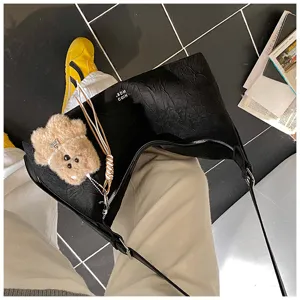 Black crinkled baguette shoulder bag for women, stylish commuter underarm bag with cute bear.