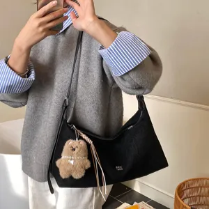 Women stylish black pleated underarm bag with cute plush bear charm, retro shoulder bag.