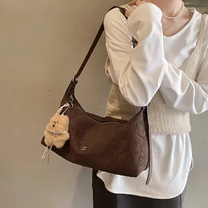 Retro brown pleated baguette bag for women, stylish vintage underarm shoulder handbag.