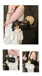 Black patent leather women shoulder bag, minimalist rivet commuter underarm bag with cute bear charm.