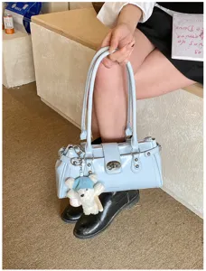 Chic rivet minimalist light blue women underarm shoulder bag closeup detail view