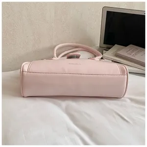 Pink stylish PU leather shoulder bag for women, trendy commute bag detail view showing sleek design.