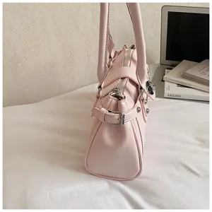 Pink chic women shoulder bag with stylish metal rivets and convenient side buckle design detail.